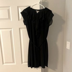 H&M short black dress with string tie waist and ruffle top.
